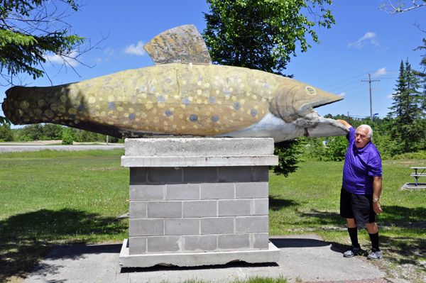 a big fish biting Lee Duquette's arm